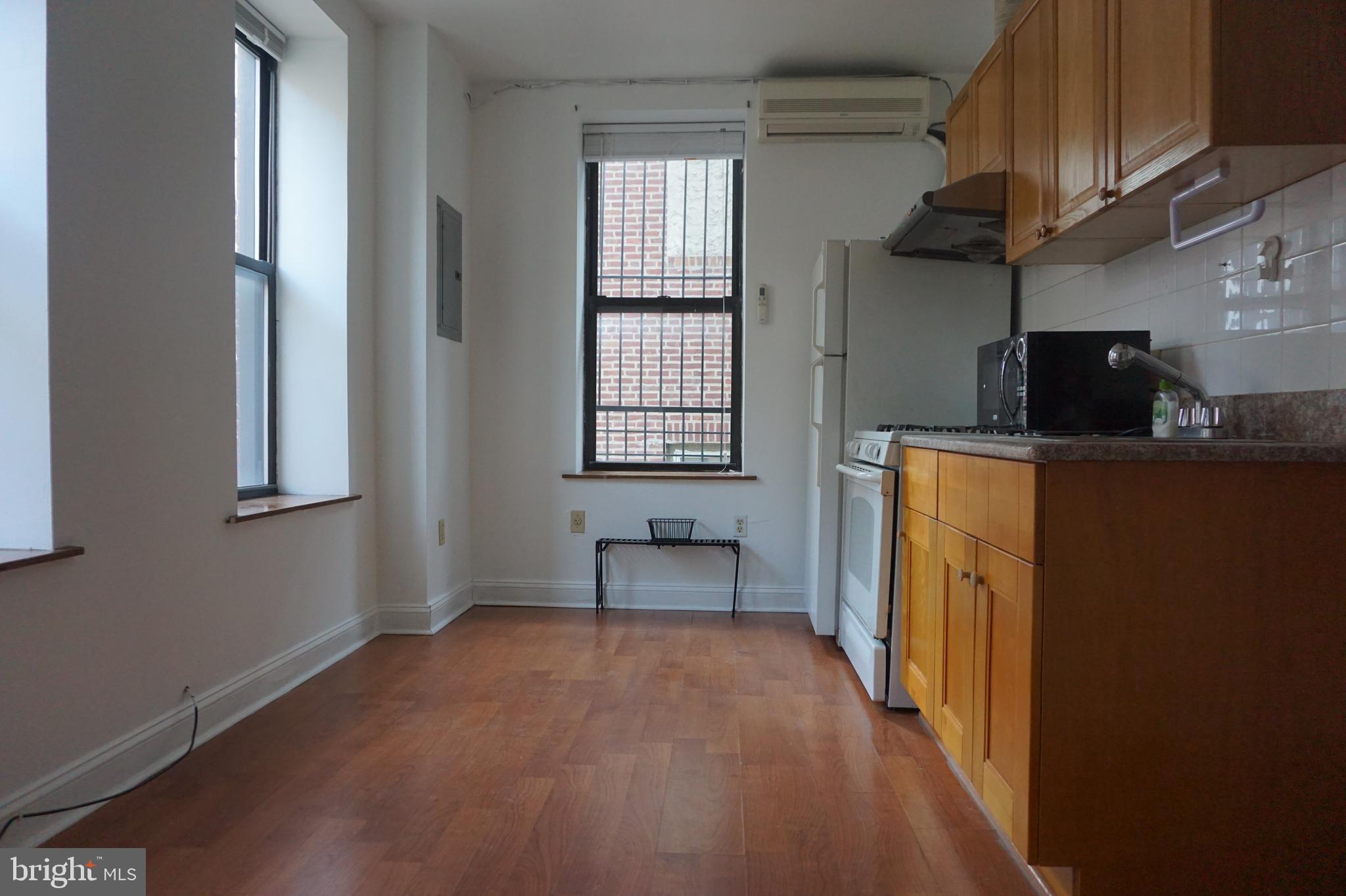 a room with window and furniture