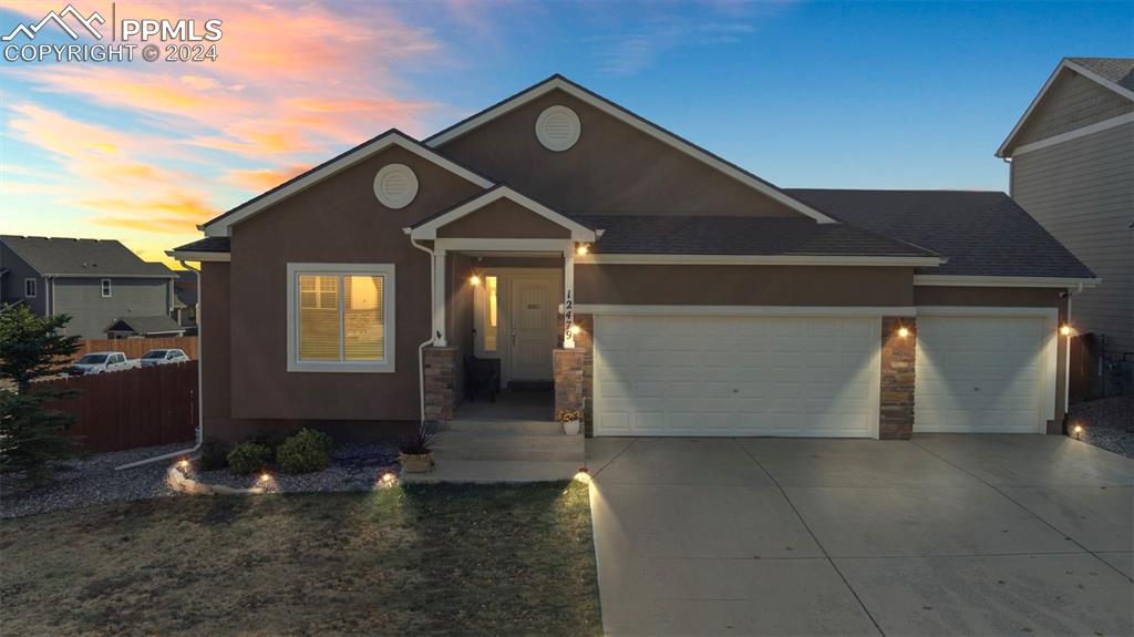 a front view of a house with yard