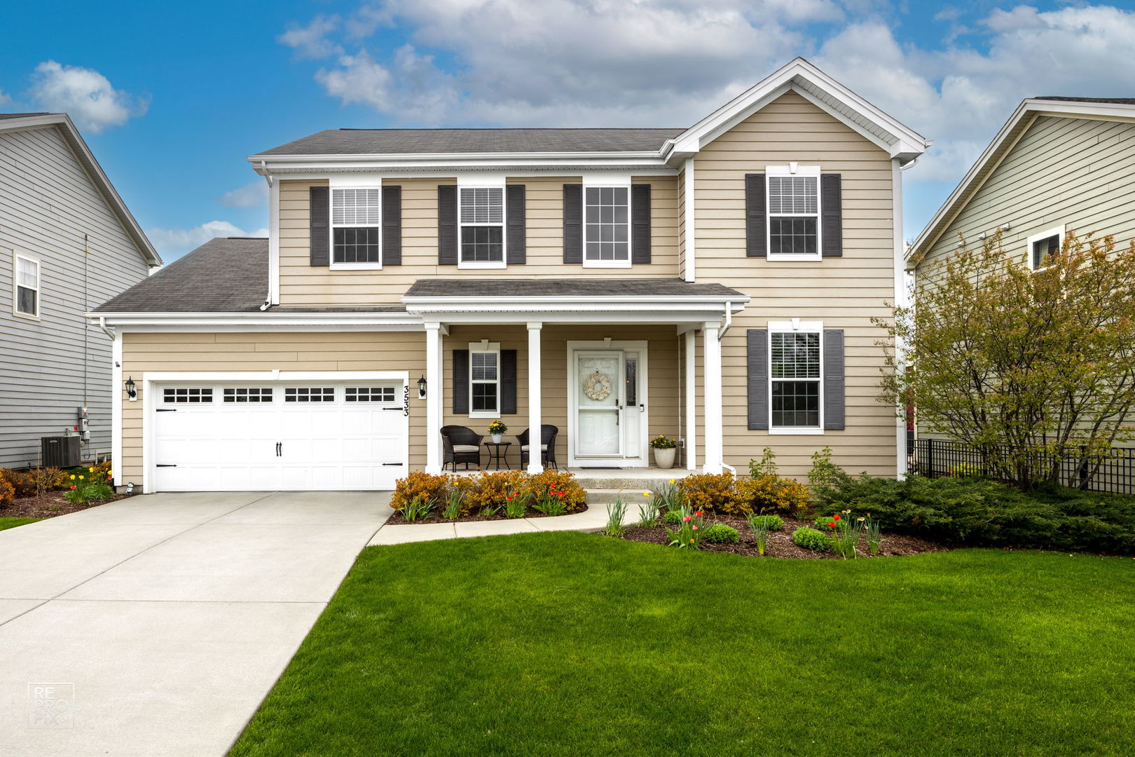 a front view of a house with a yard