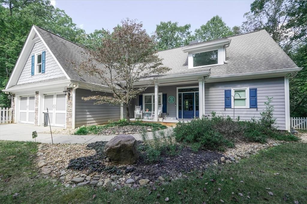 a front view of a house with garden