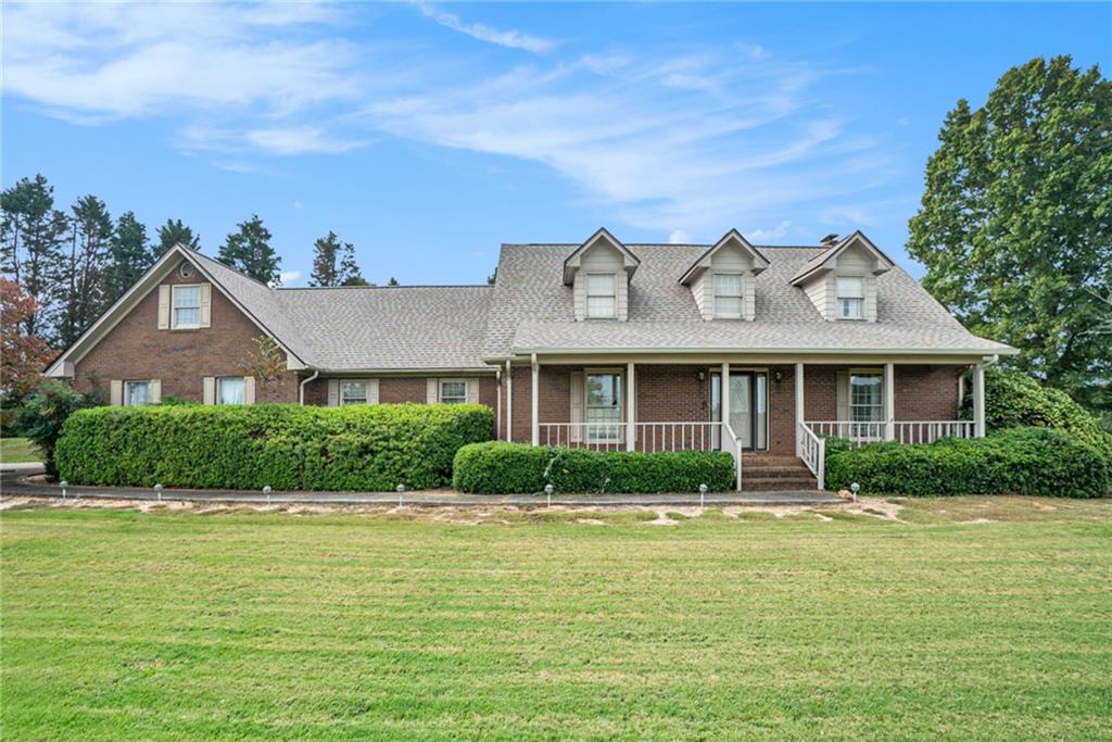 a front view of a house with garden