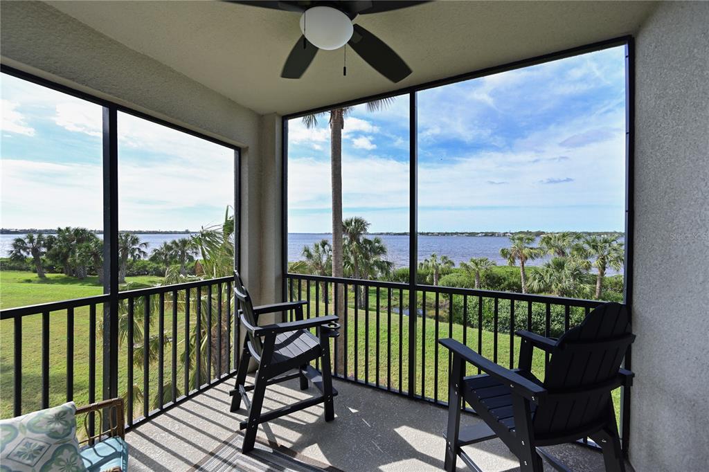 a view of a balcony with furniture