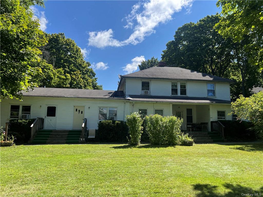 Front view of house featuring a yard