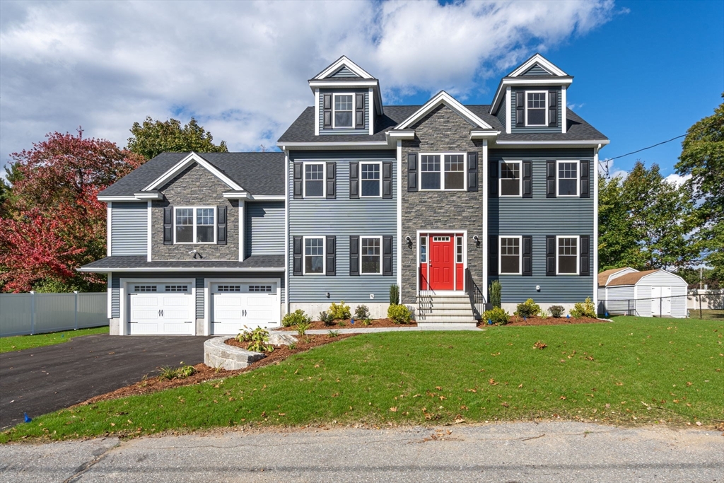 a front view of a house with a yard