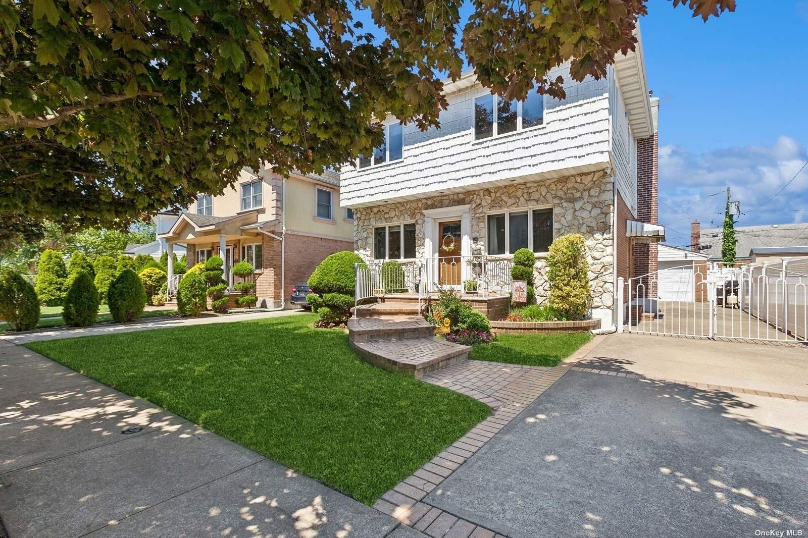 a view of a house with a yard patio and fire pit