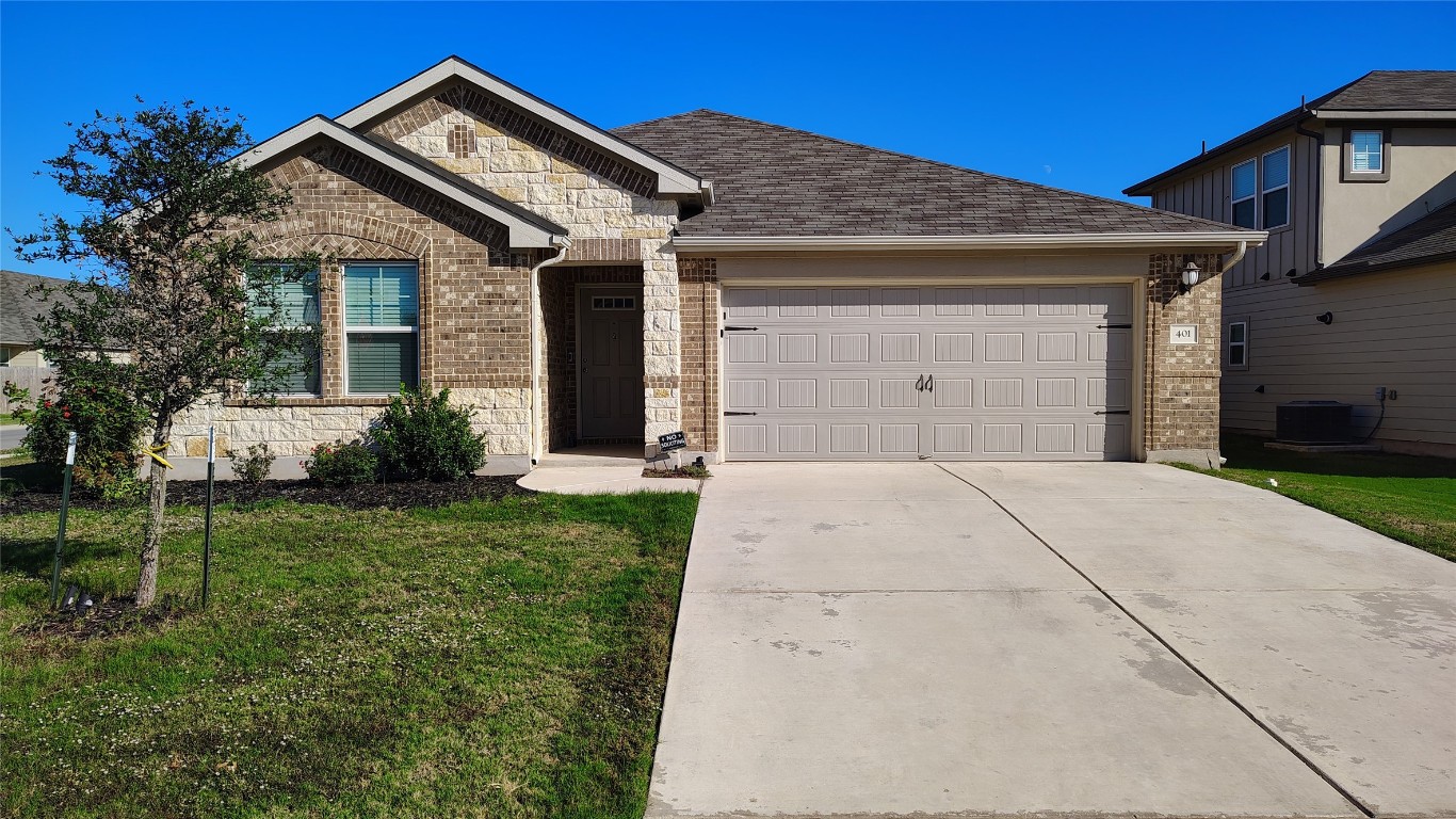 front view of a house with a yard