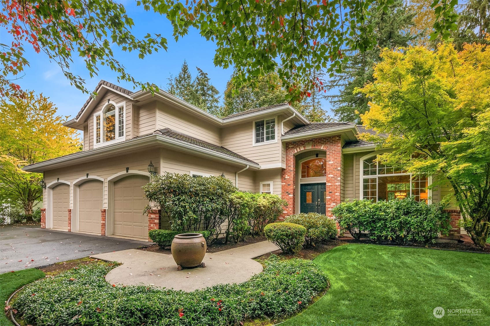 front view of a house with potted plants