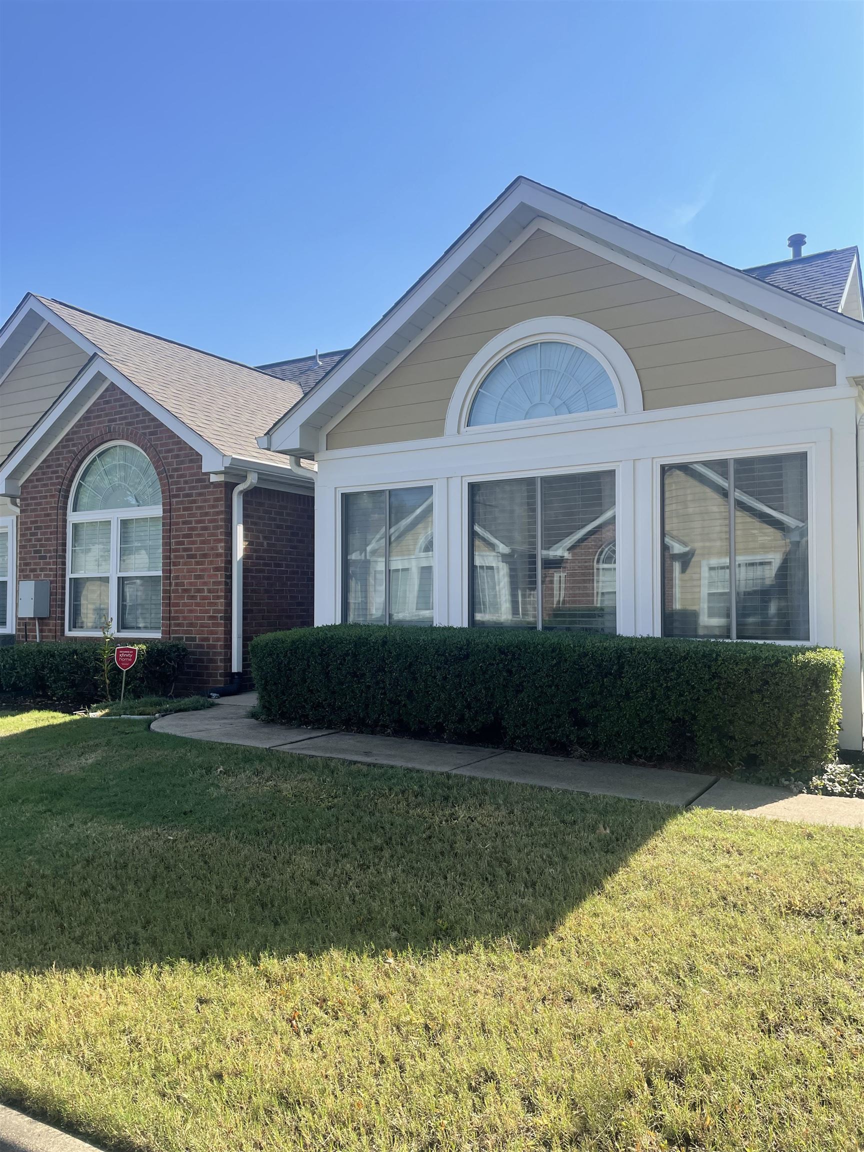 a front view of a house with a yard