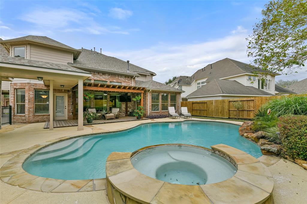 an outdoor view of house with swimming pool having outdoor seating