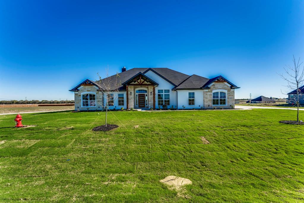 a view of a house with a big yard