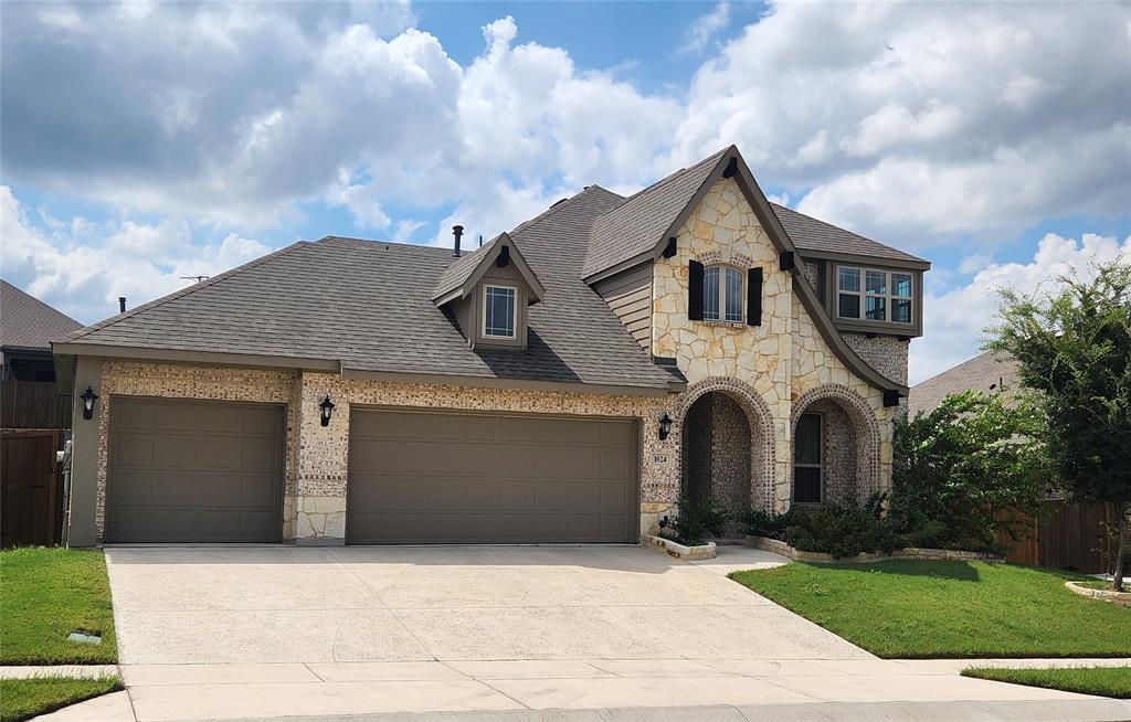 a front view of a house with yard