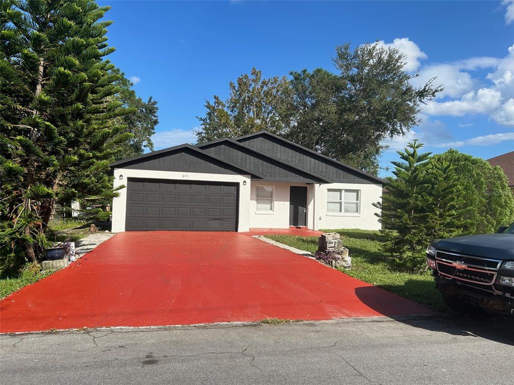 a house with yard in front of it