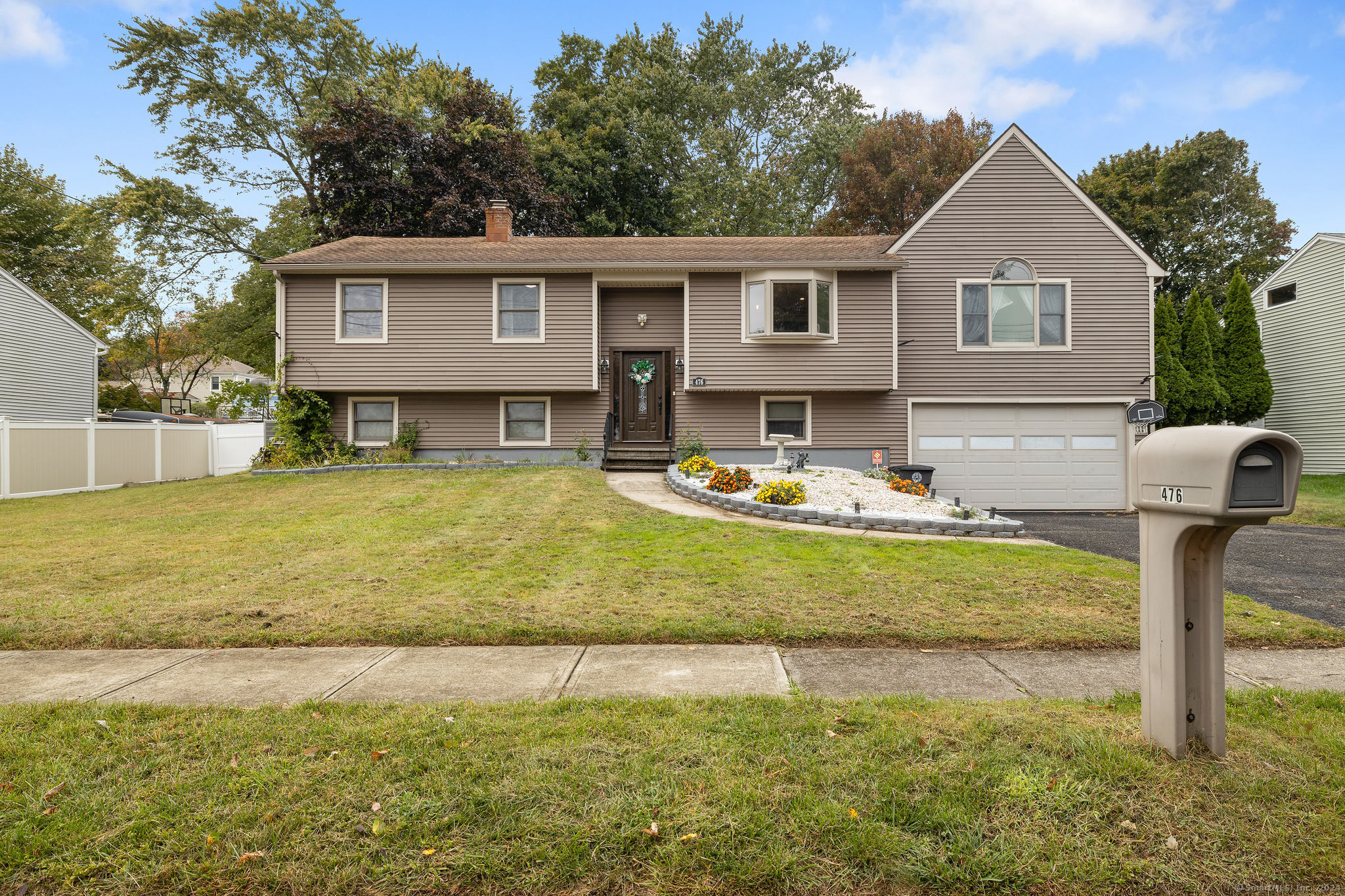 a front view of a house with garden