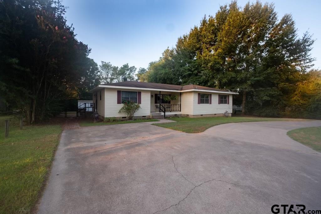 a view of house with outdoor space and yard