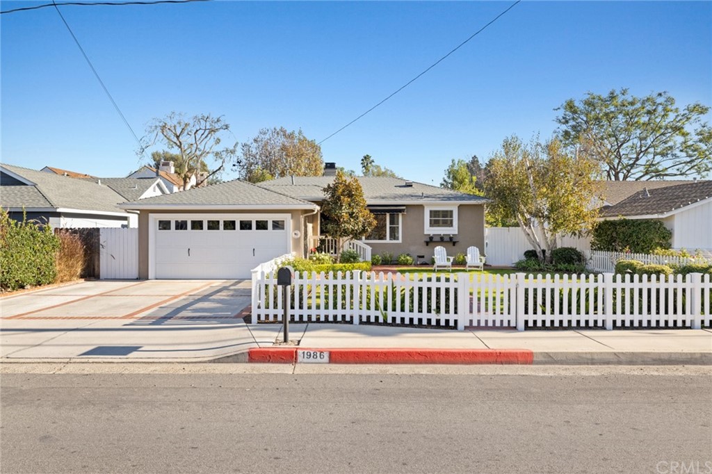 a view of a house with a iron gate