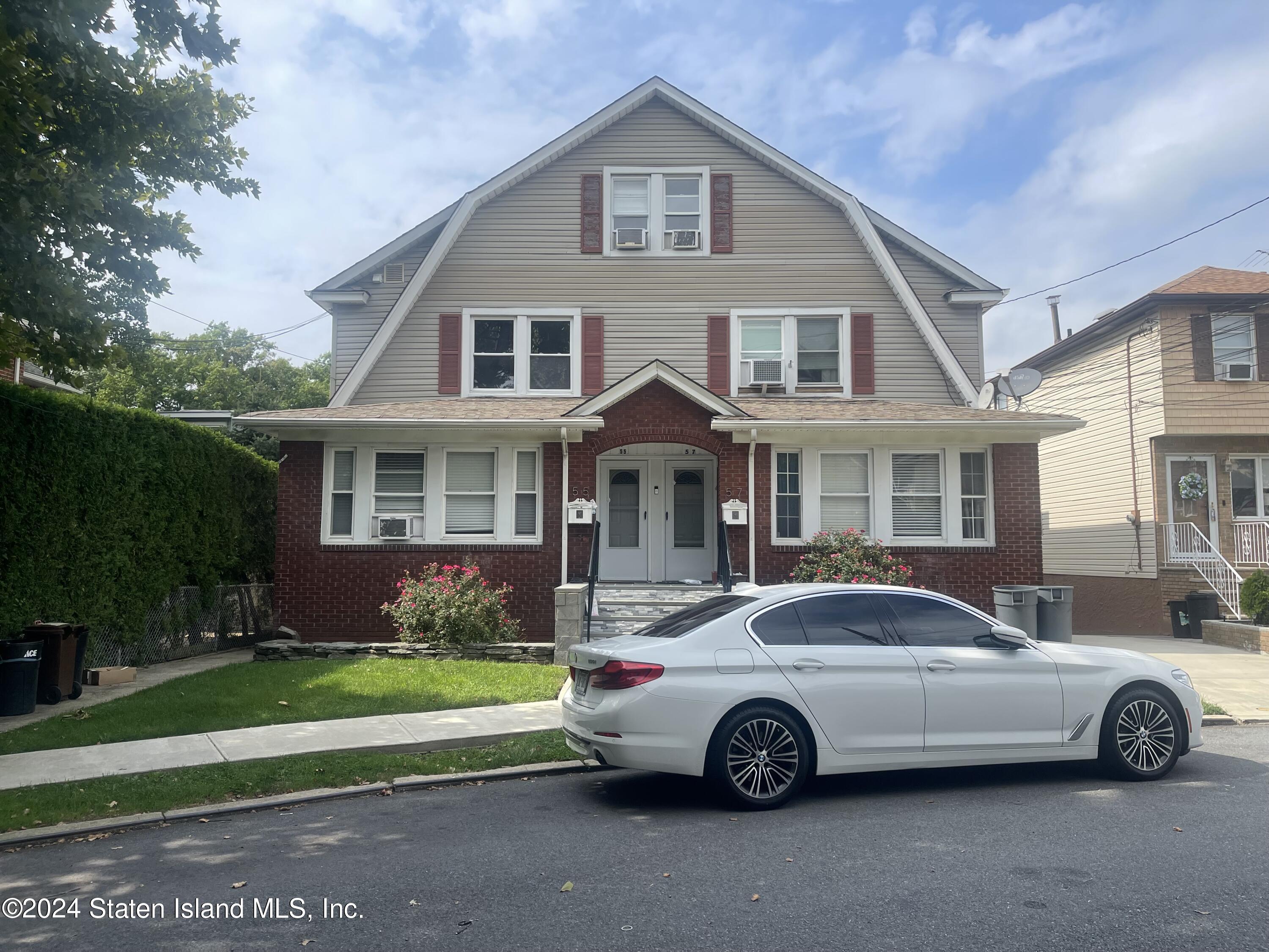 a car parked in front of a house