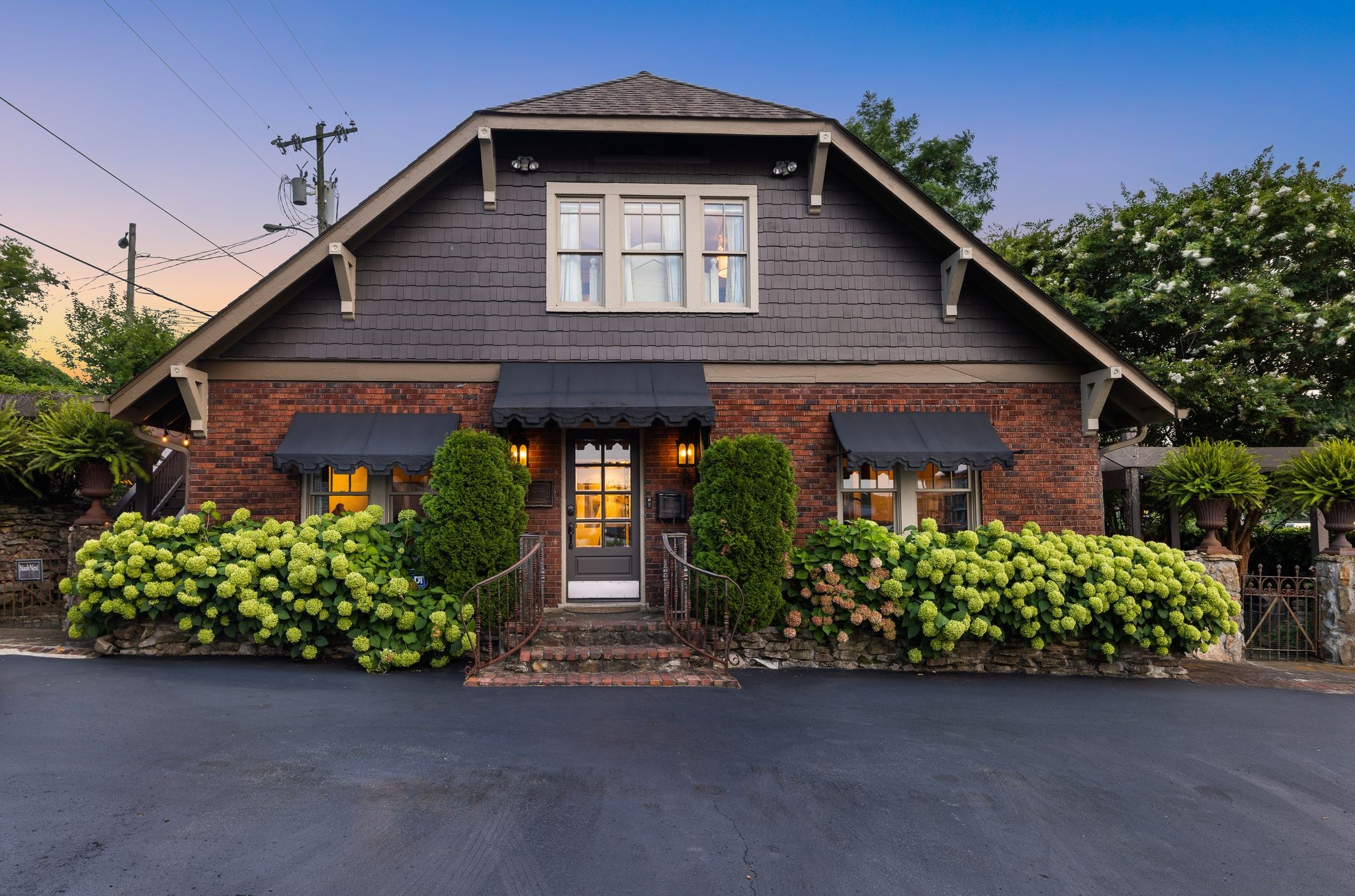 a front view of a house with garden