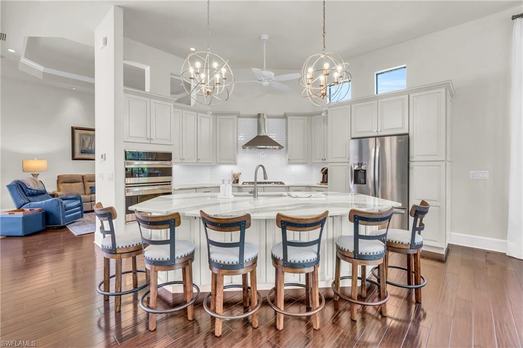 a kitchen with dining table and chairs