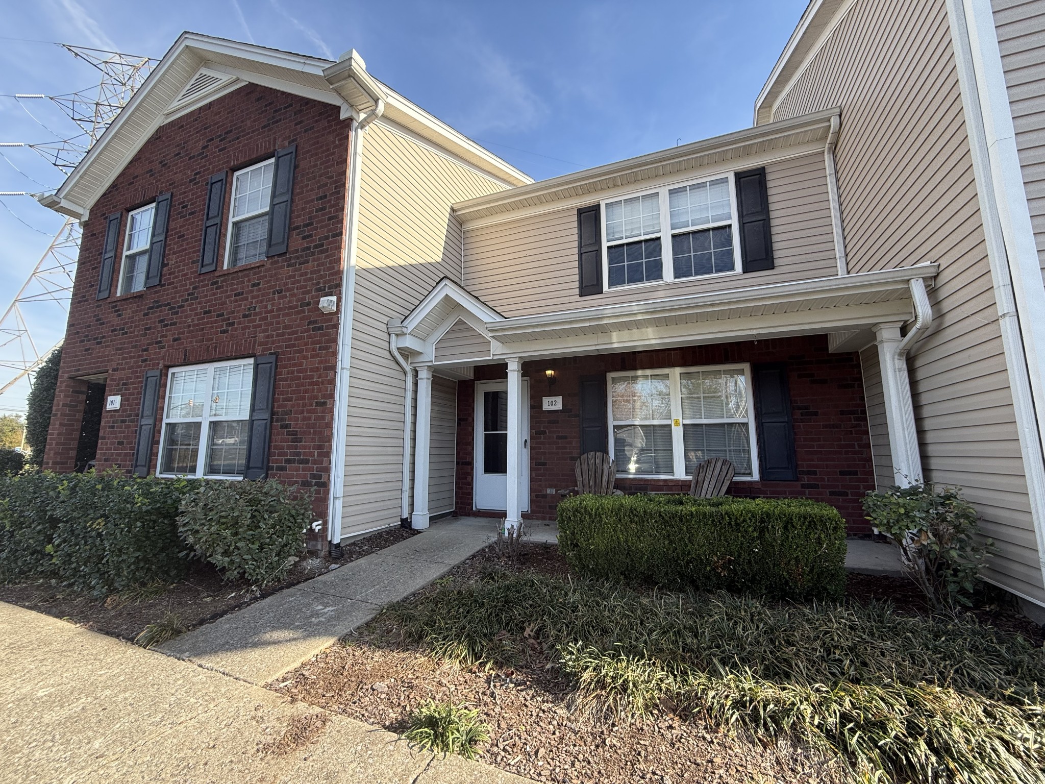 a front view of a house with a yard