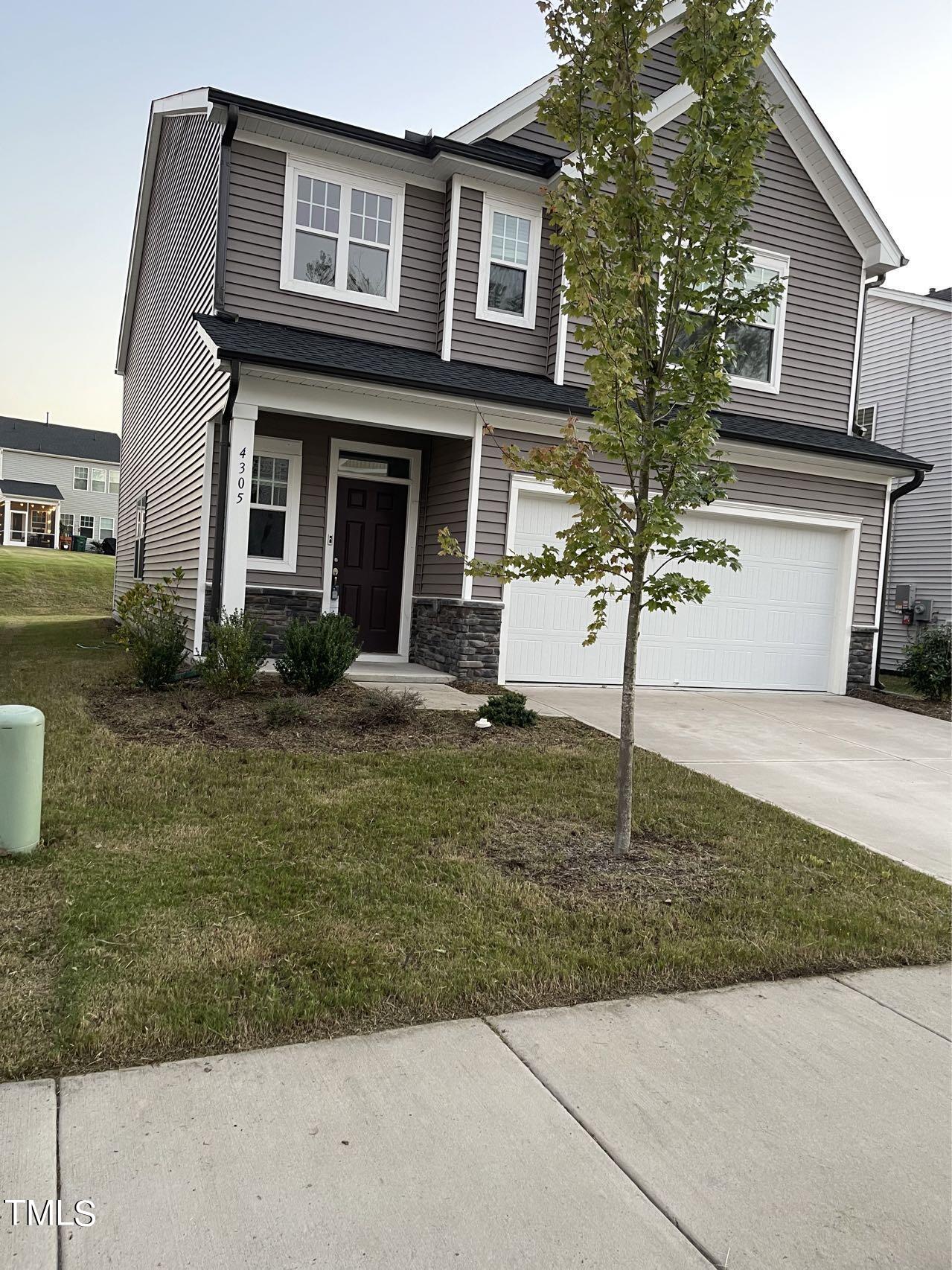 a view of a yard in front of a house