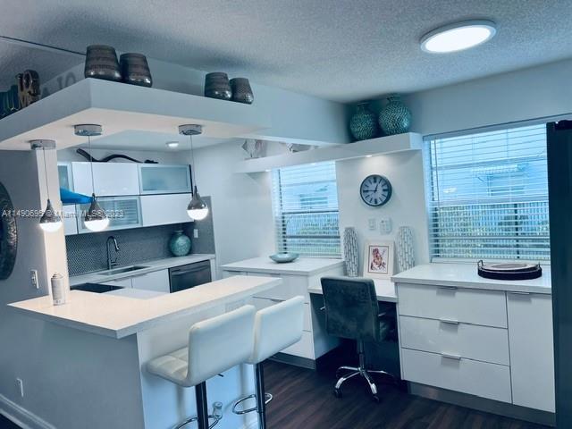 a room with cabinets and wooden floor