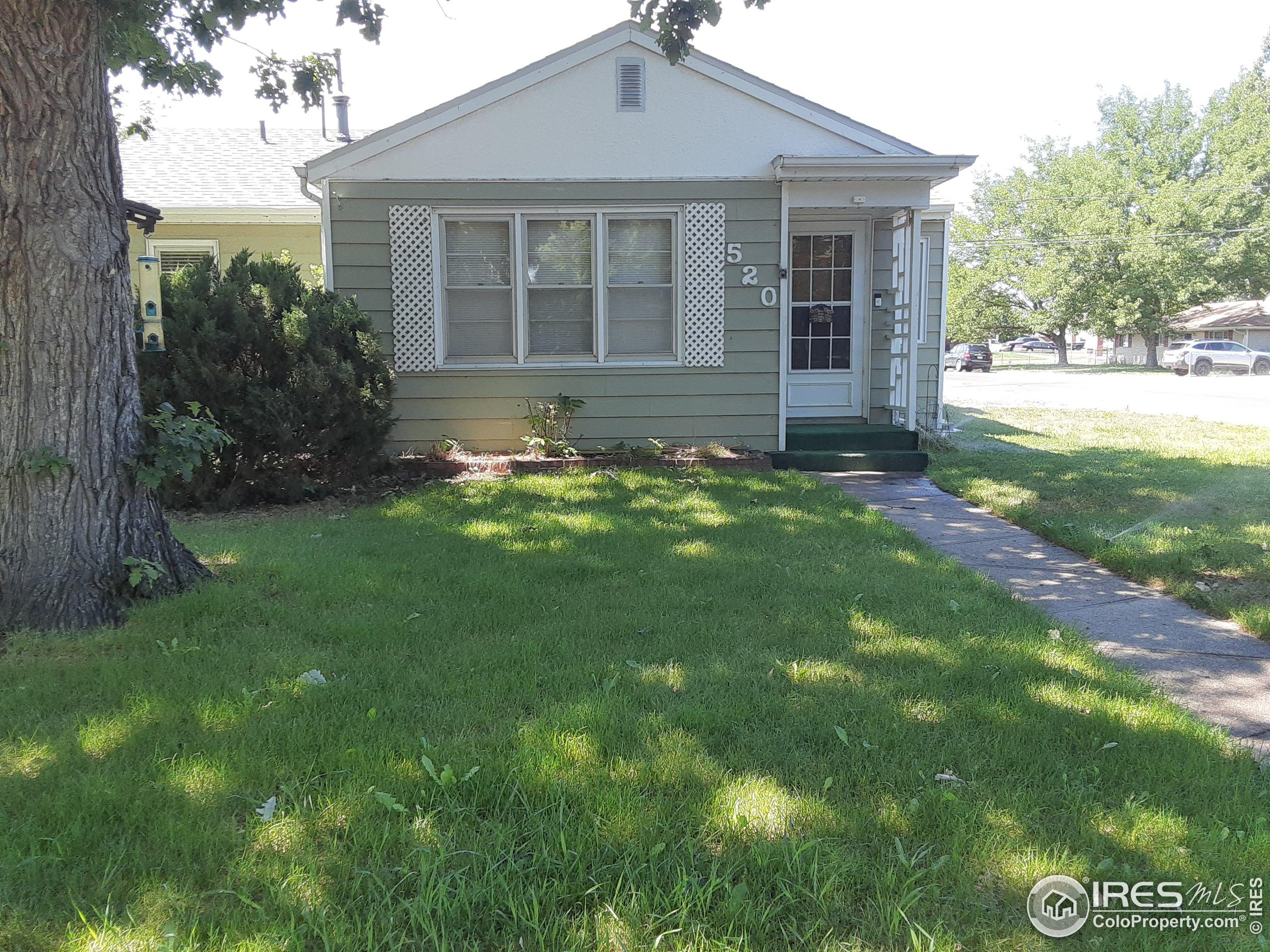 a front view of a house with yard