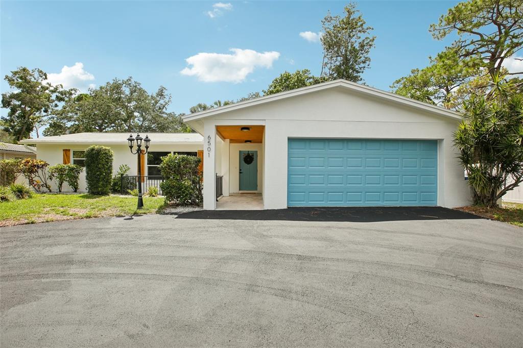 a front view of a house with a garage