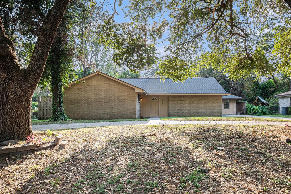 a house with trees in front of it