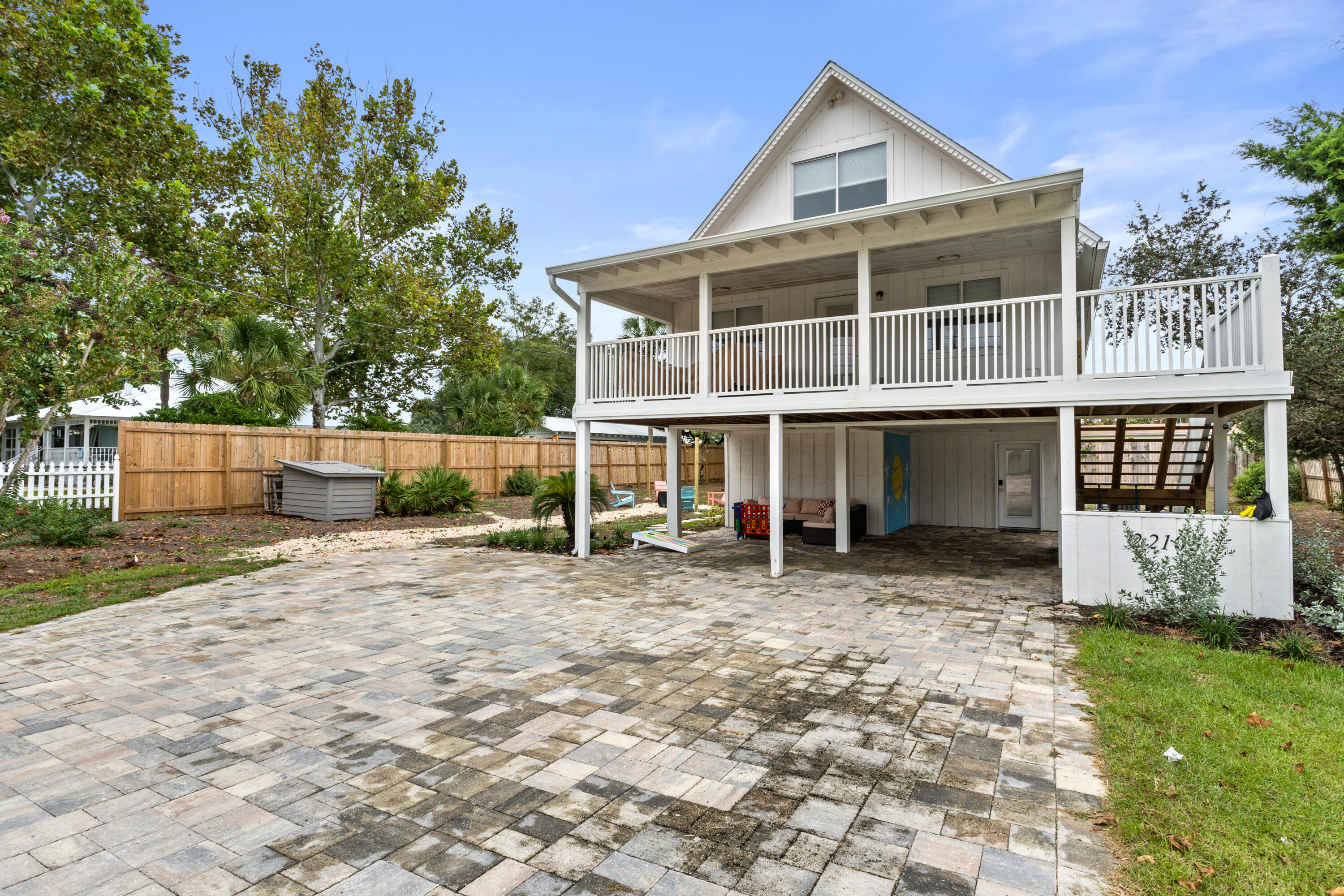 a view of a house with a yard and sitting area