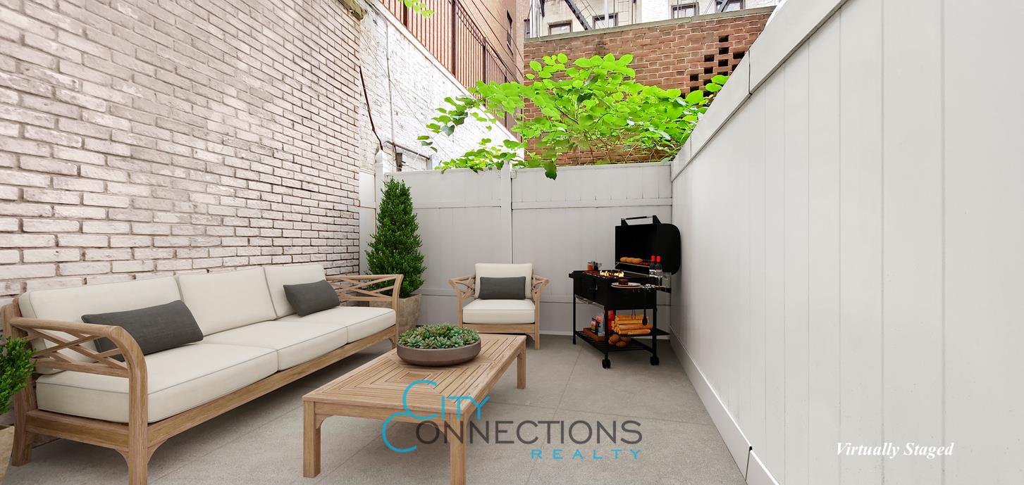 a living room with furniture and a potted plant