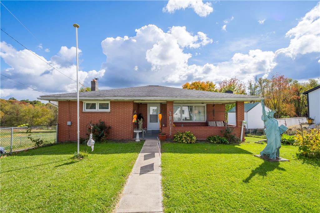 front view of a house with a yard