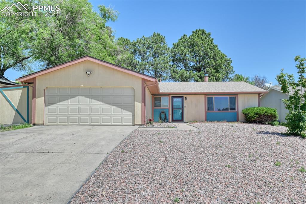 Single story home featuring a garage