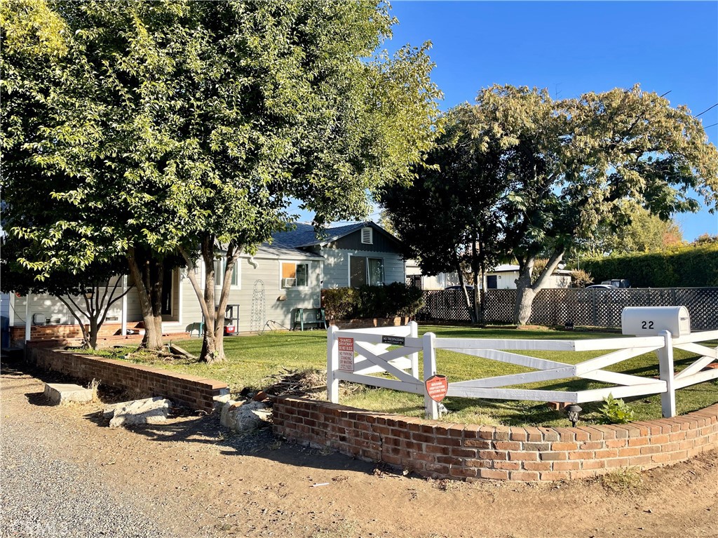 a view of a house with a yard covered in snow