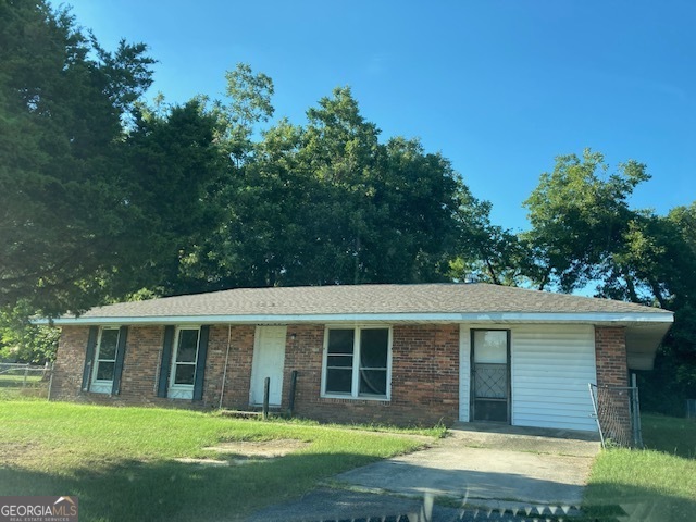 front view of a house with a yard