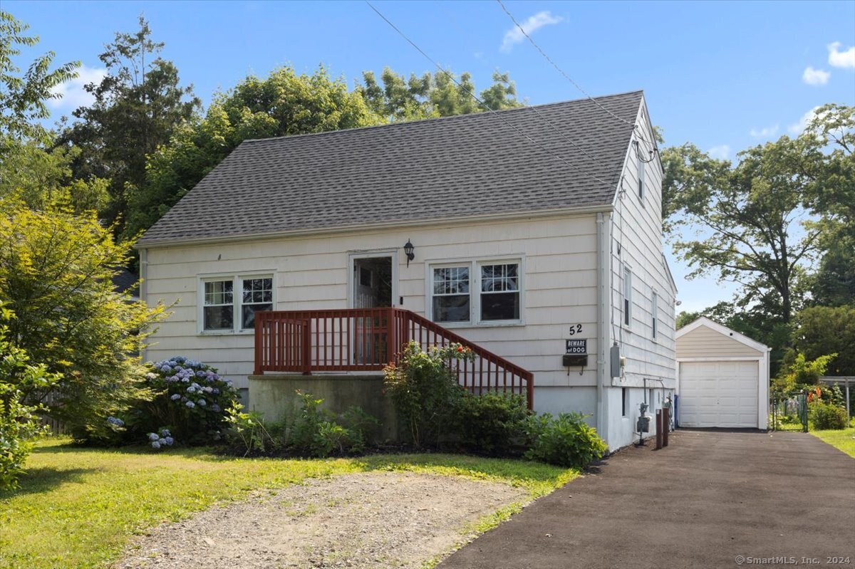 a house that has a tree in front of it