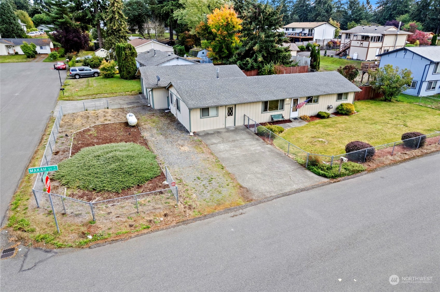 a aerial view of a house with garden space and street view