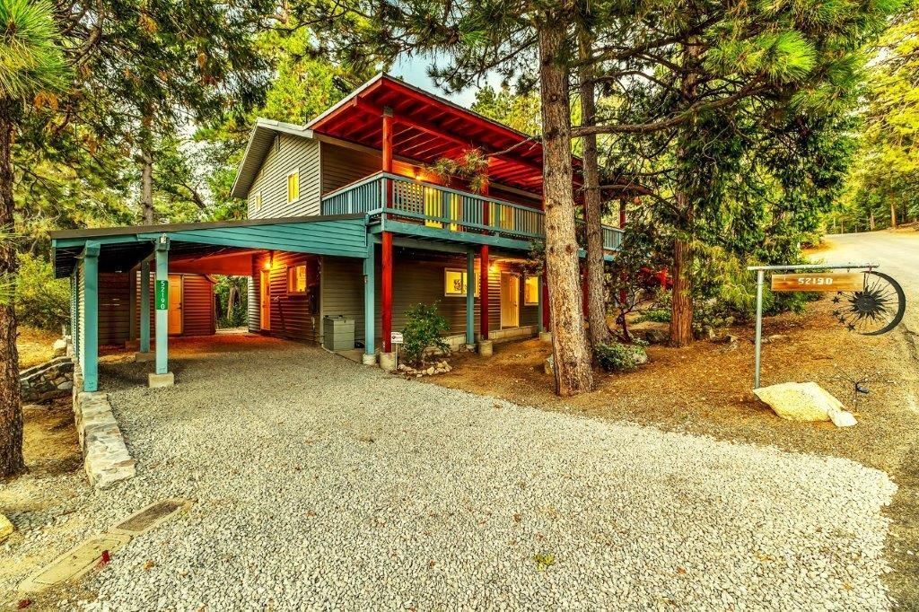 a view of a house with a yard and sitting area