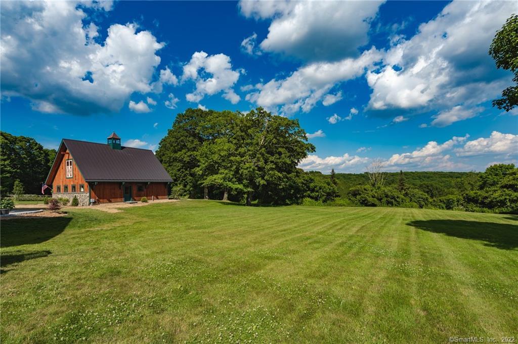 a view of a house with a big yard