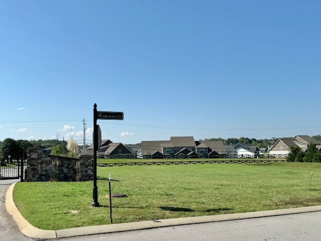 a view of a golf course with a lake