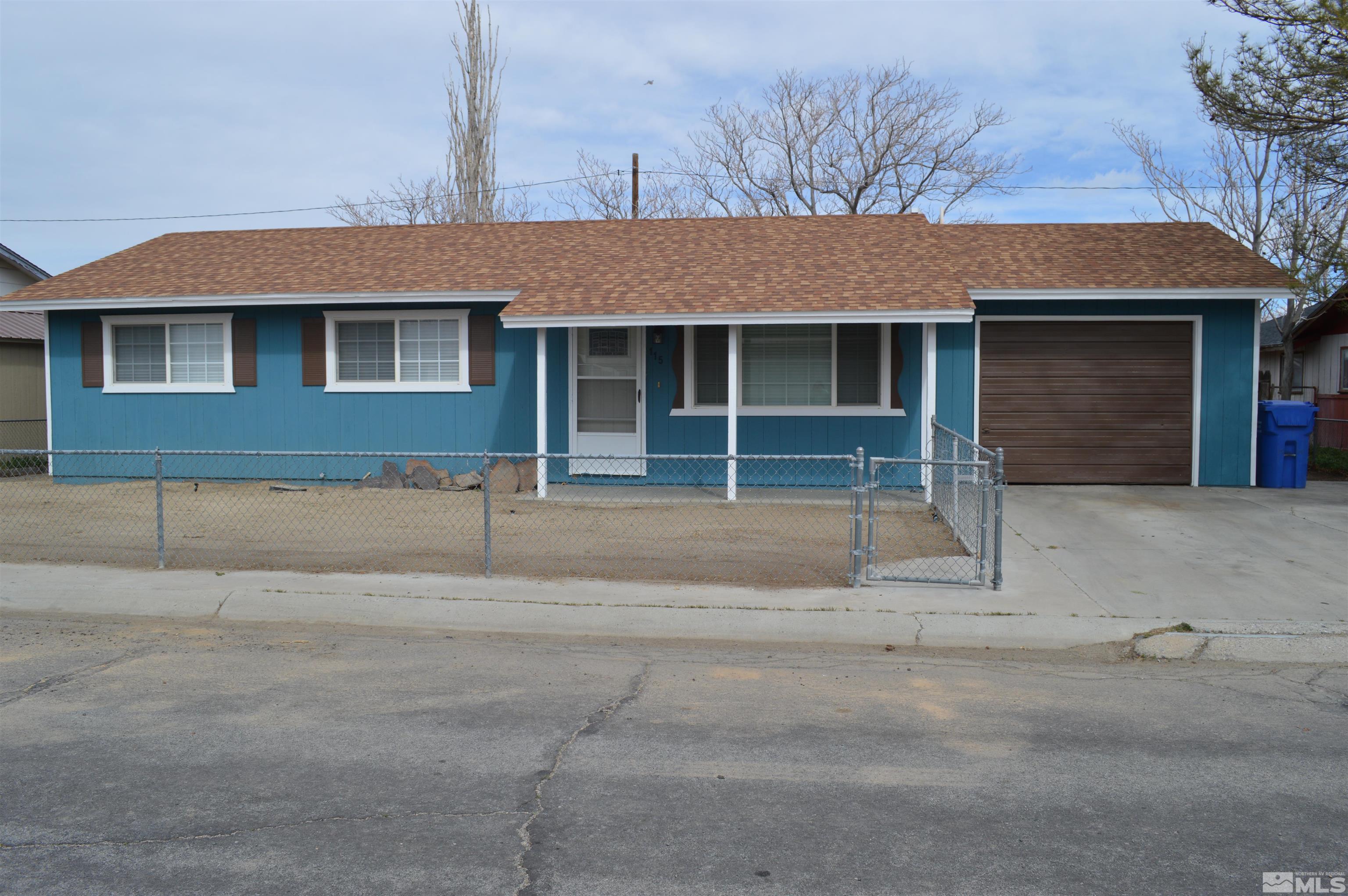 a front view of a house with a garage