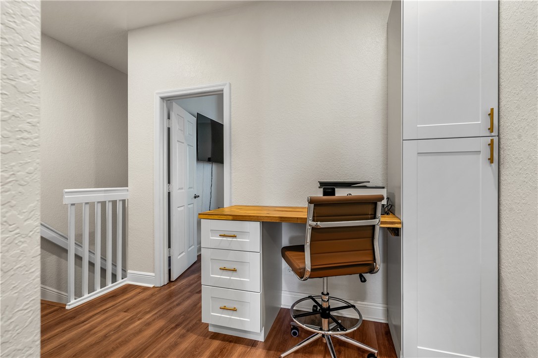 a view of workspace with wooden floor