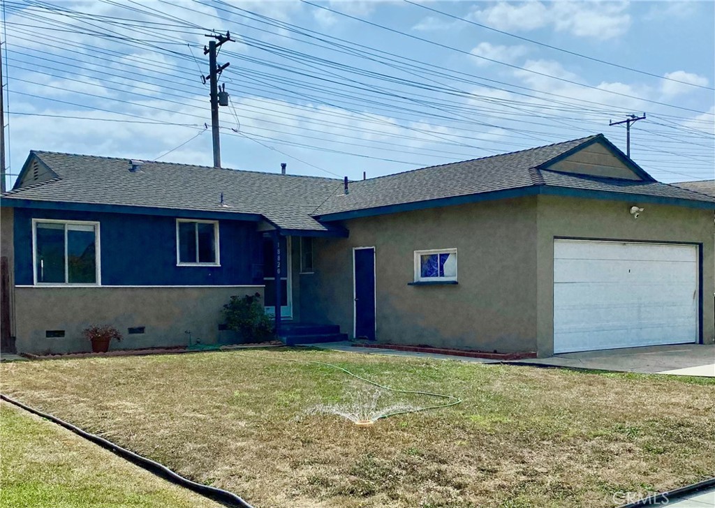 a front view of a house with garage