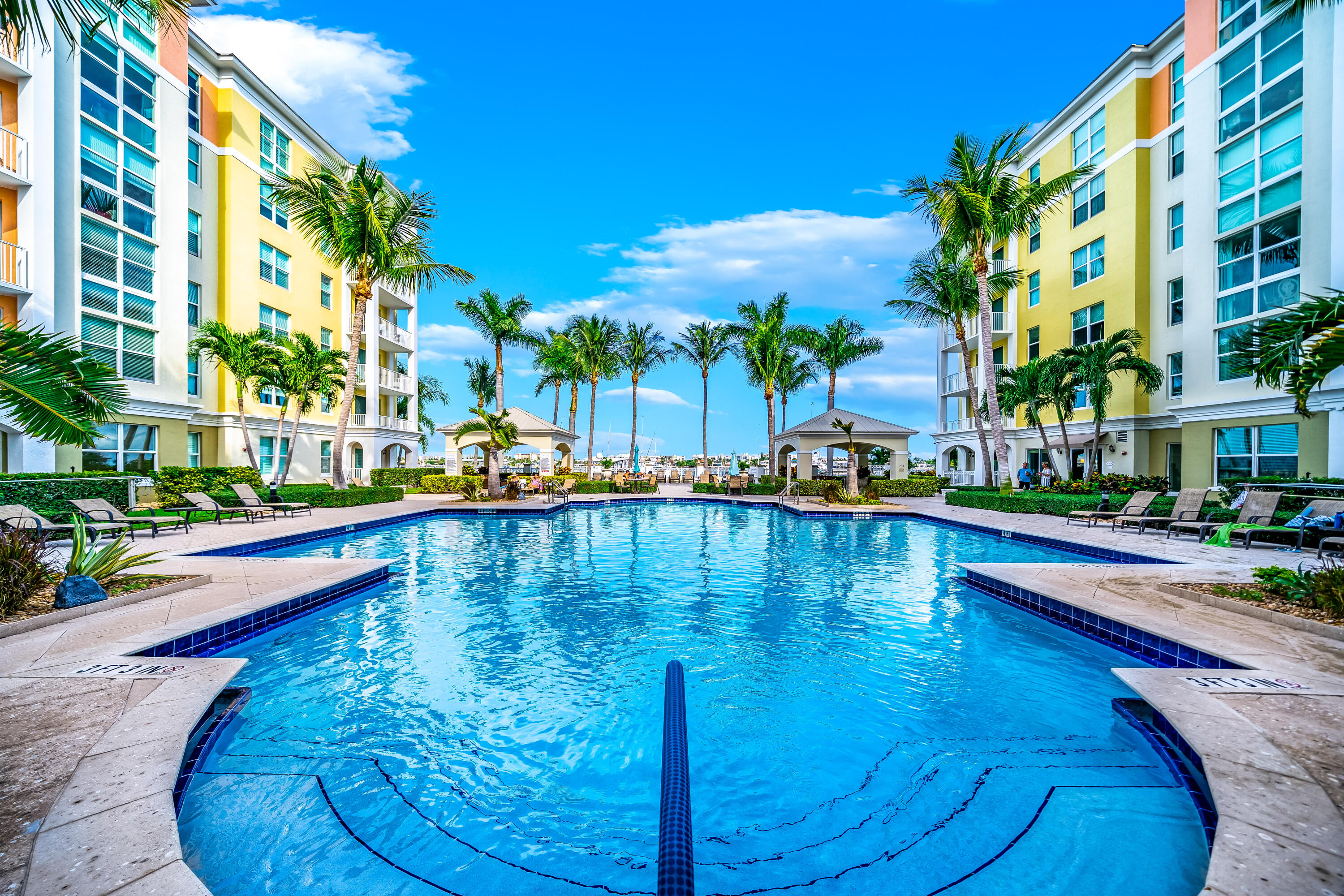 a swimming pool with outdoor seating and yard