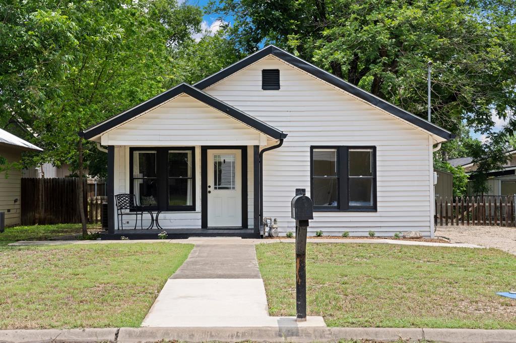 a front view of house with small garden