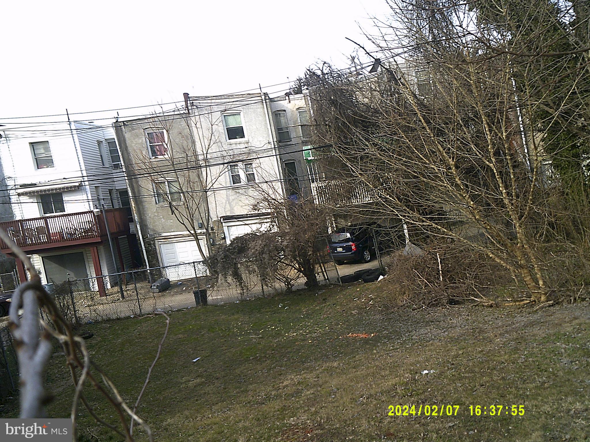 a view of a street with big house