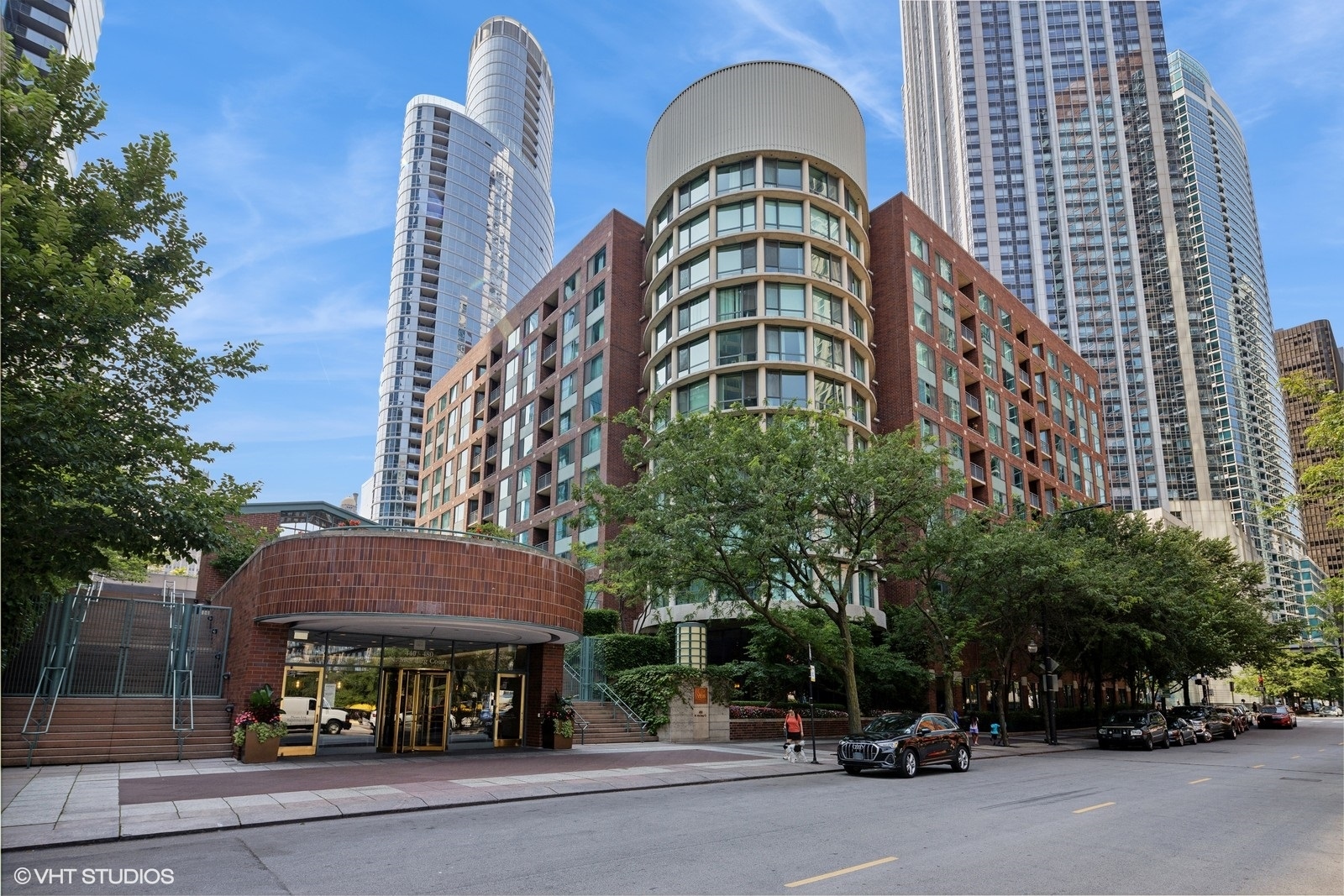 a view of a building with car parked