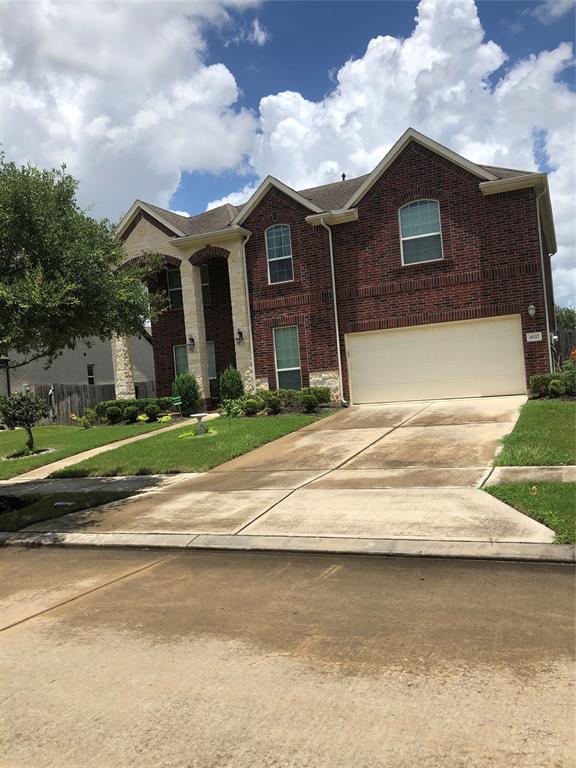 Large Front Yard with lush green landscape