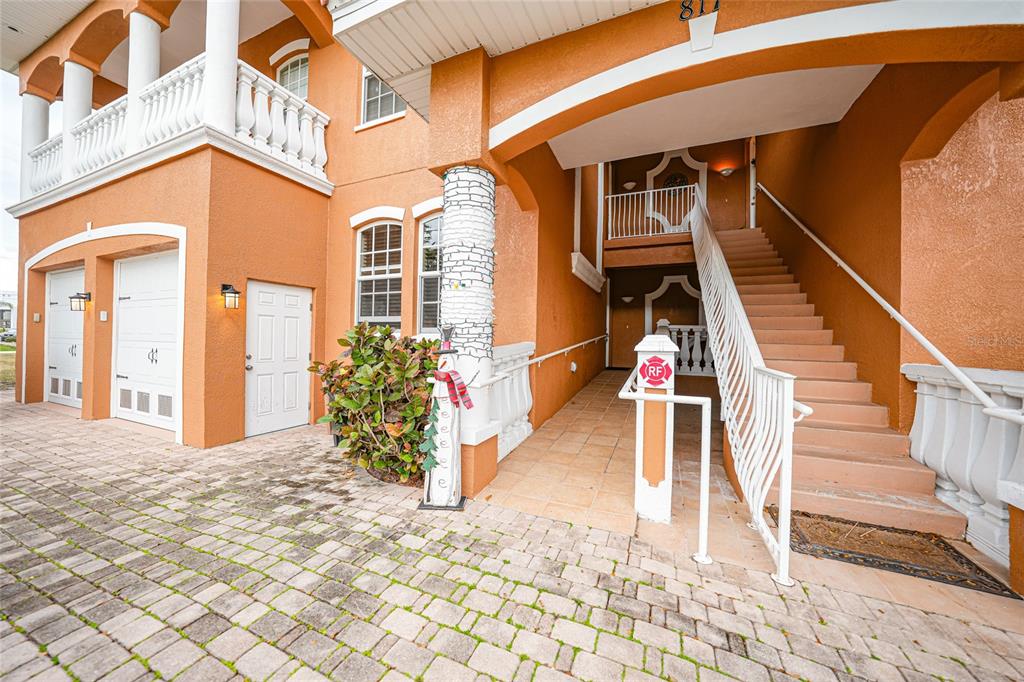 a view of a house with wooden fence