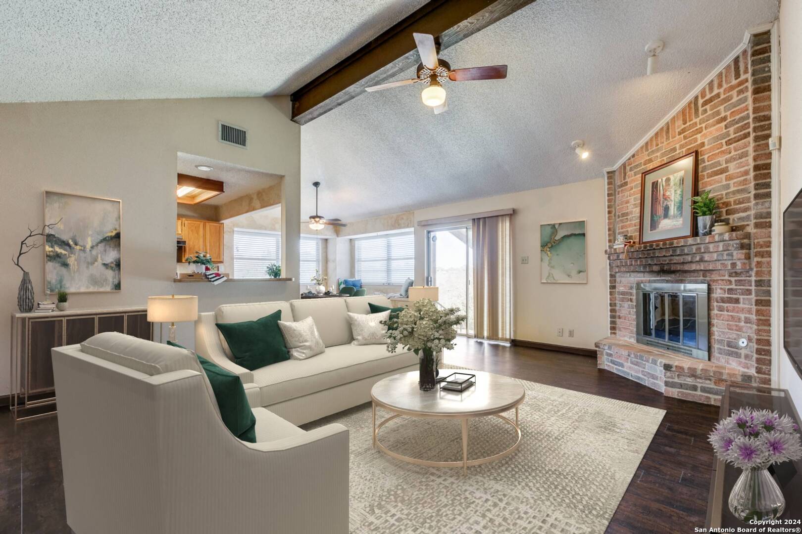 a living room with furniture and a fireplace