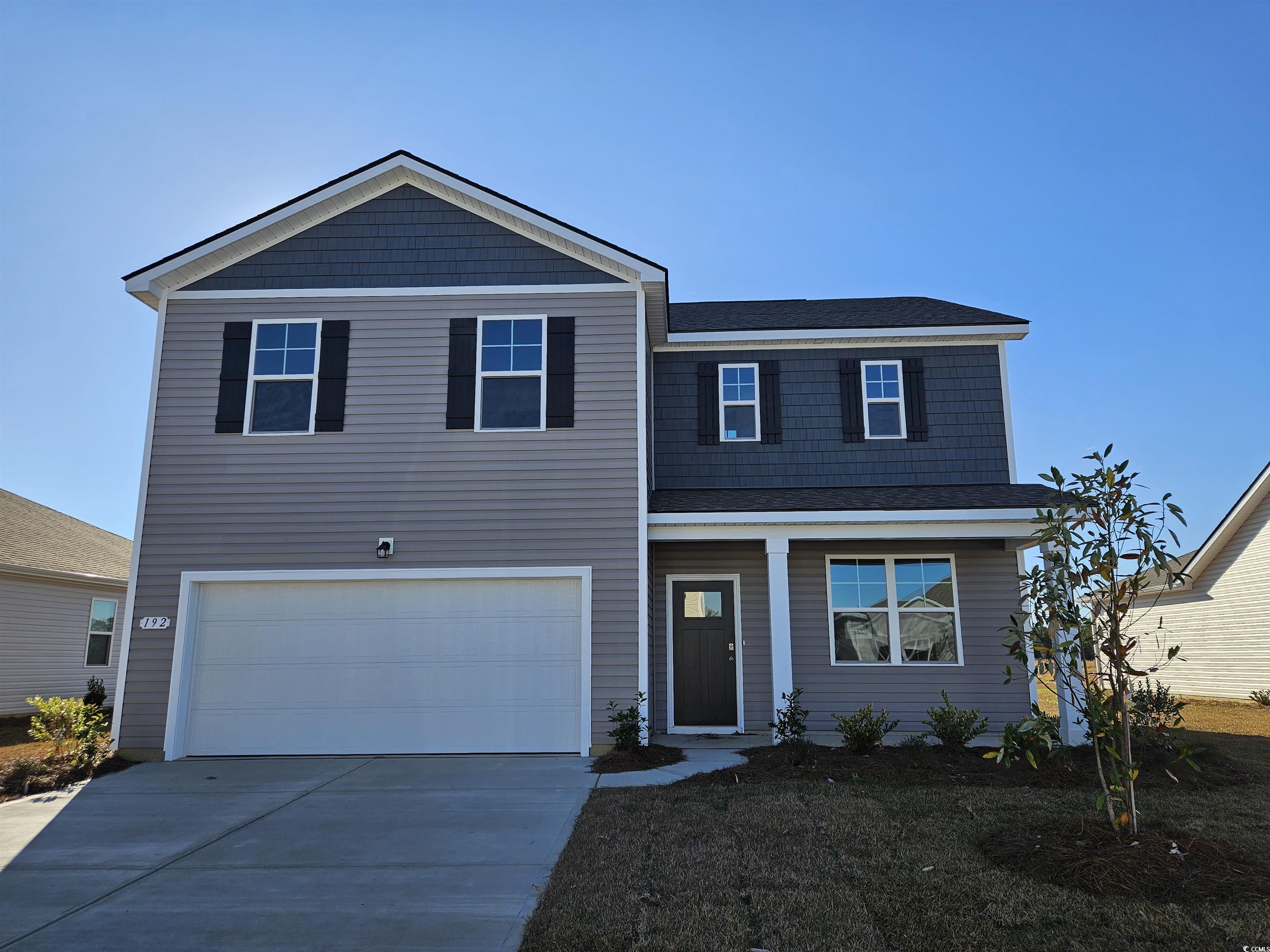 View of front of property featuring a garage